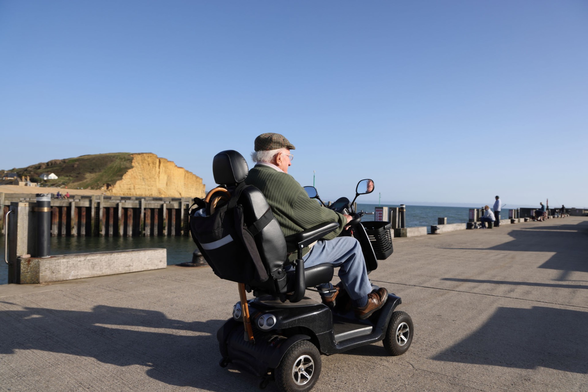 Old gentleman using mobility scooter for sightseeing